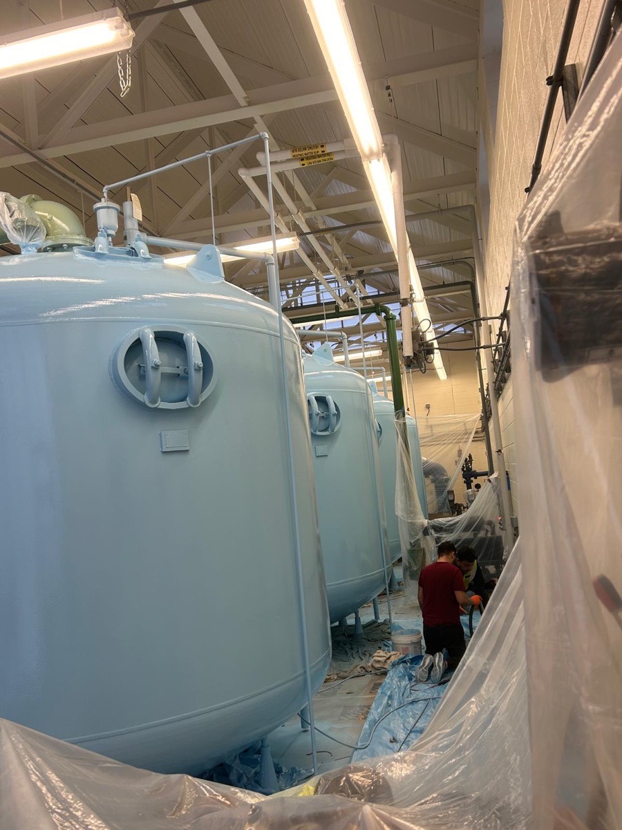 Industrial tanks after coating, clean light gray finish