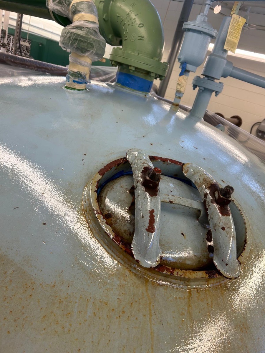Industrial tank before coating, rust around the fittings