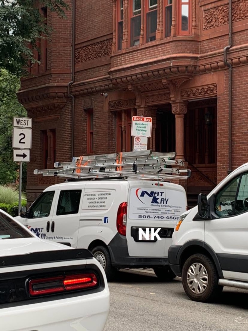 Nat Kay van with ladders at a historic brownstone in Back Bay, Boston