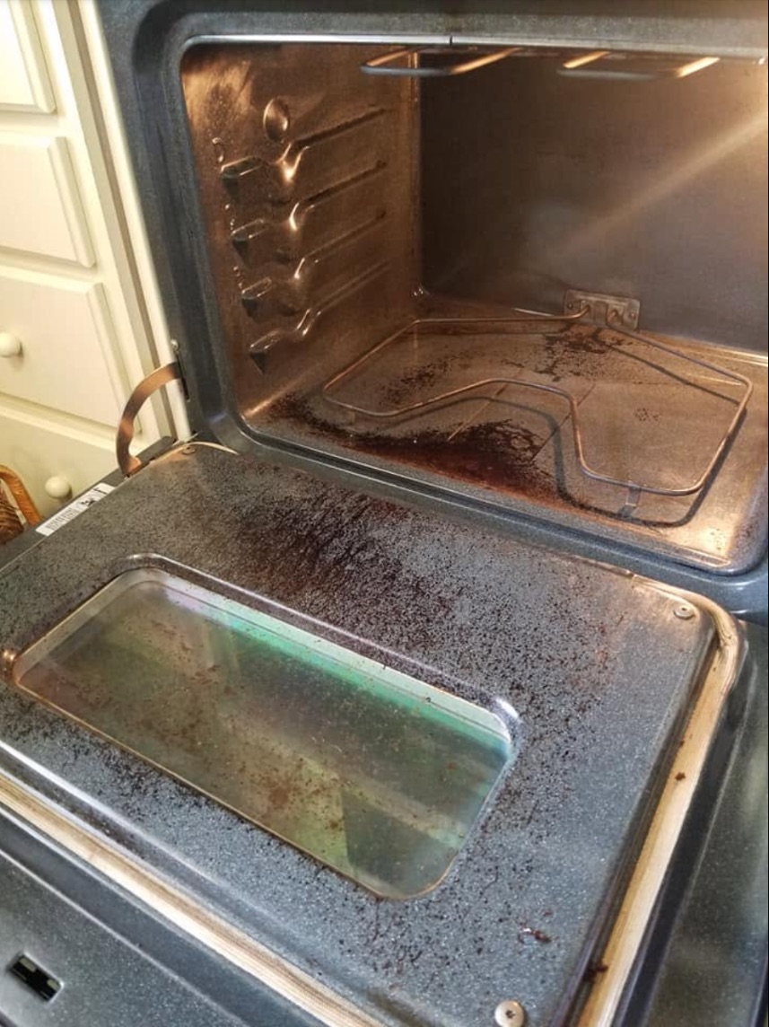Oven before cleaning, covered in burnt grease
